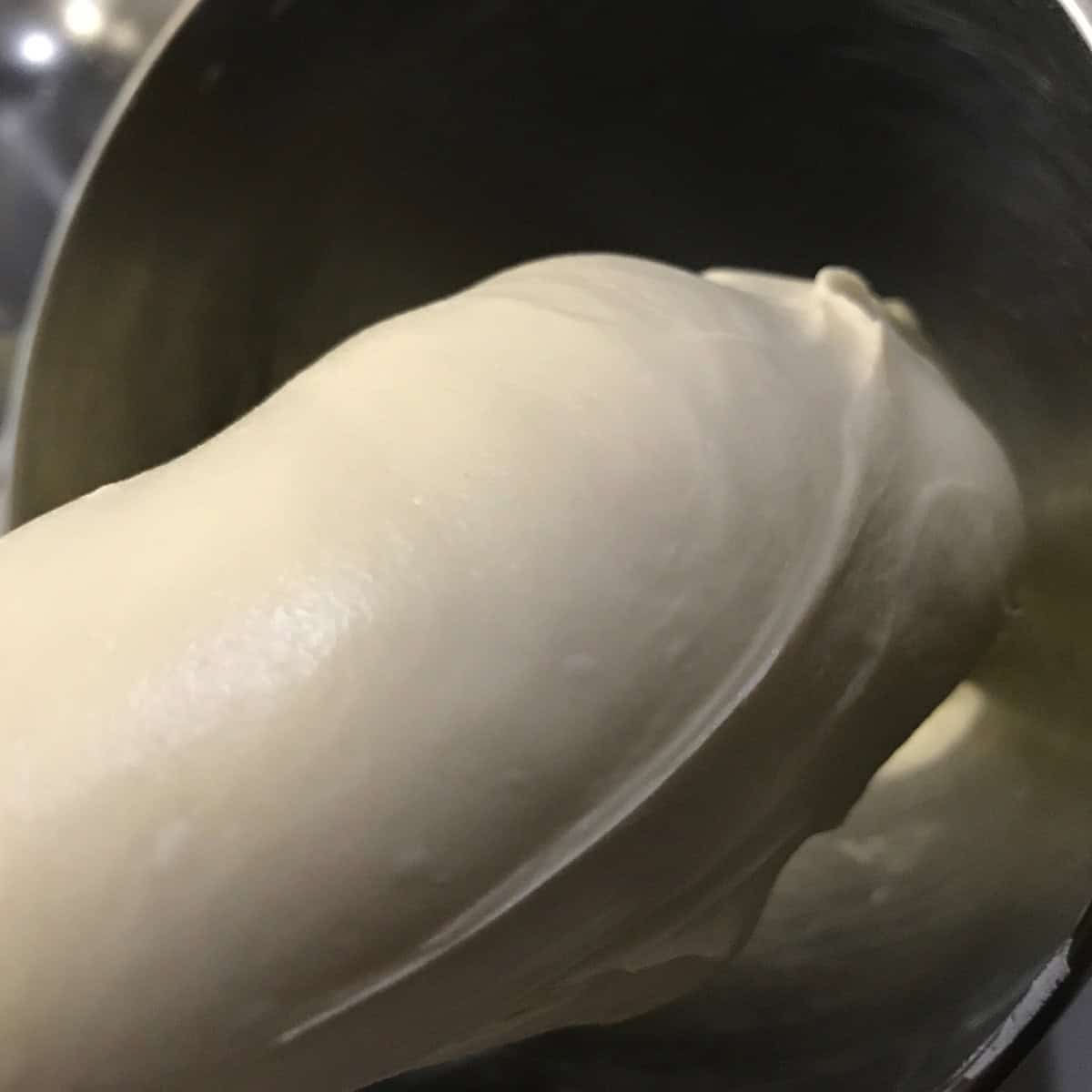Fully developed, smooth, shiny dough in mixer.
