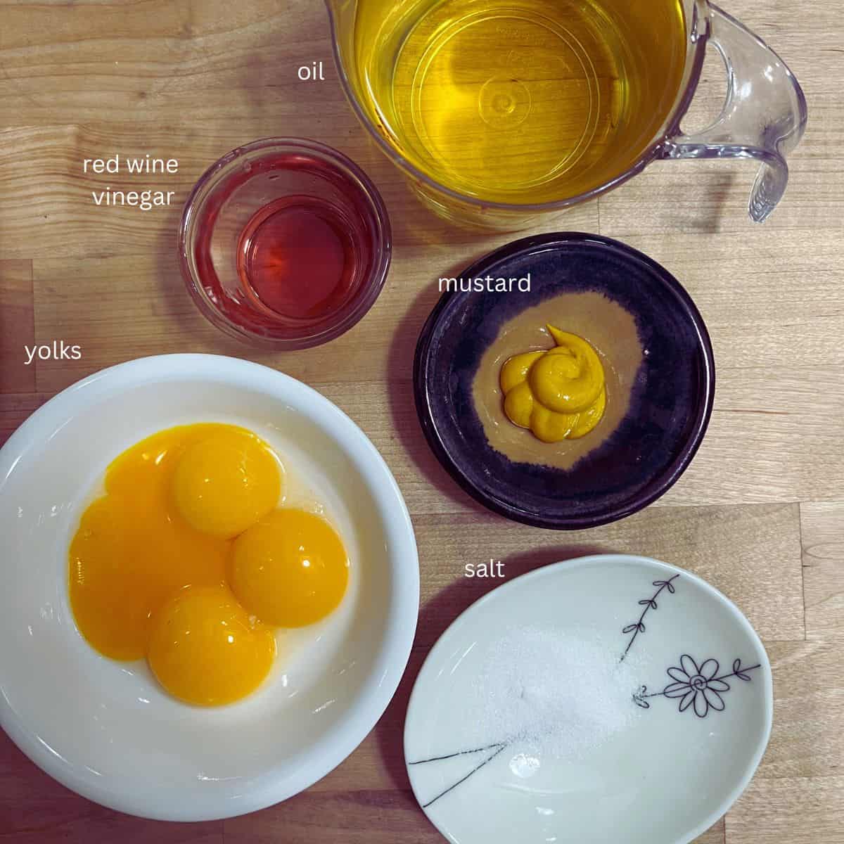 Ingredients.  Yolk, mustard, salt, vinegar and oil.
