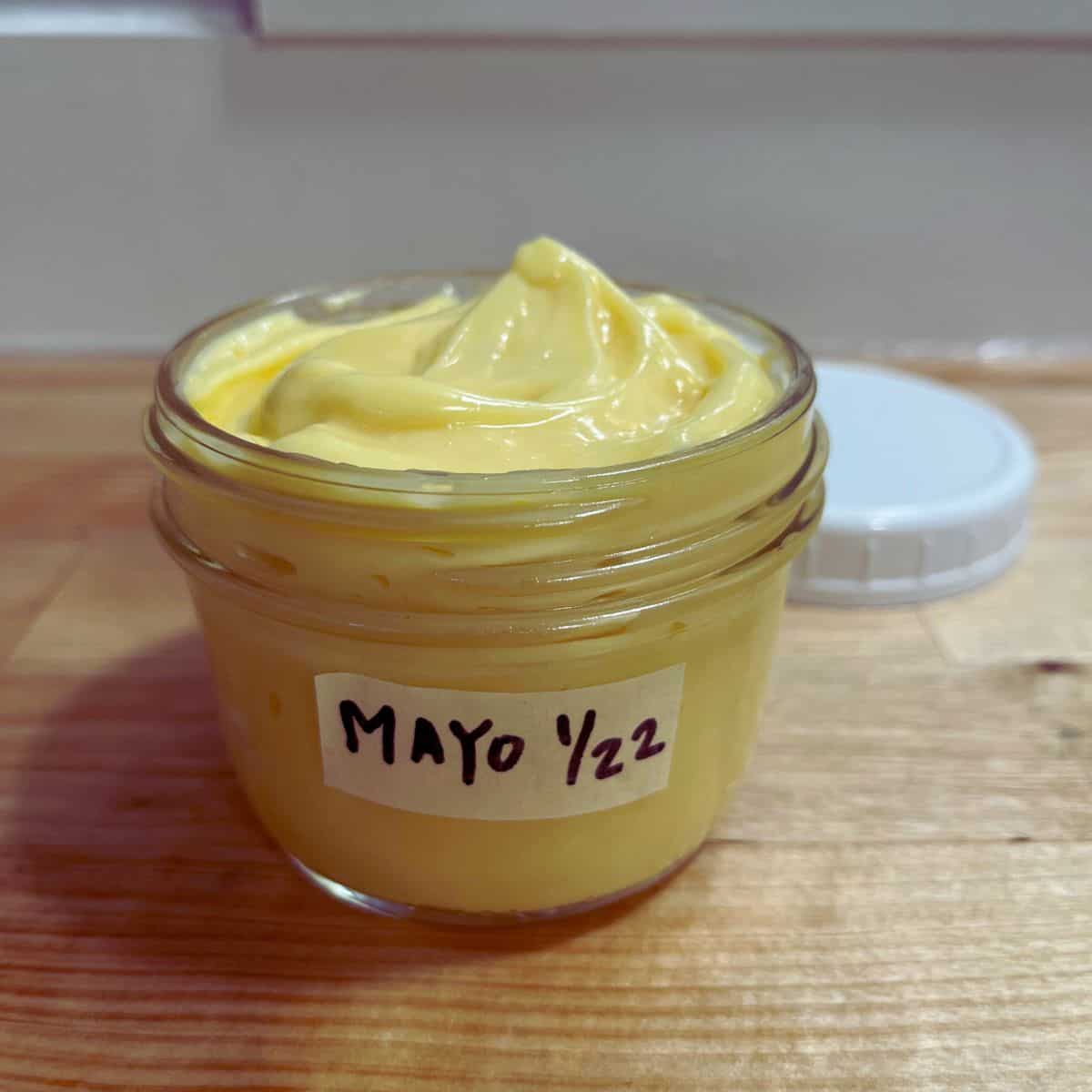 An 8oz mason jar of mayonnaise with a label that reads "mayo 1/22".  
