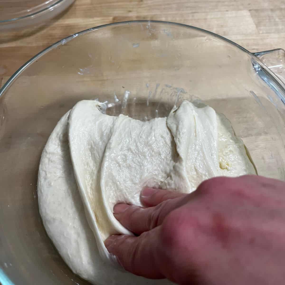 Folding over dough.