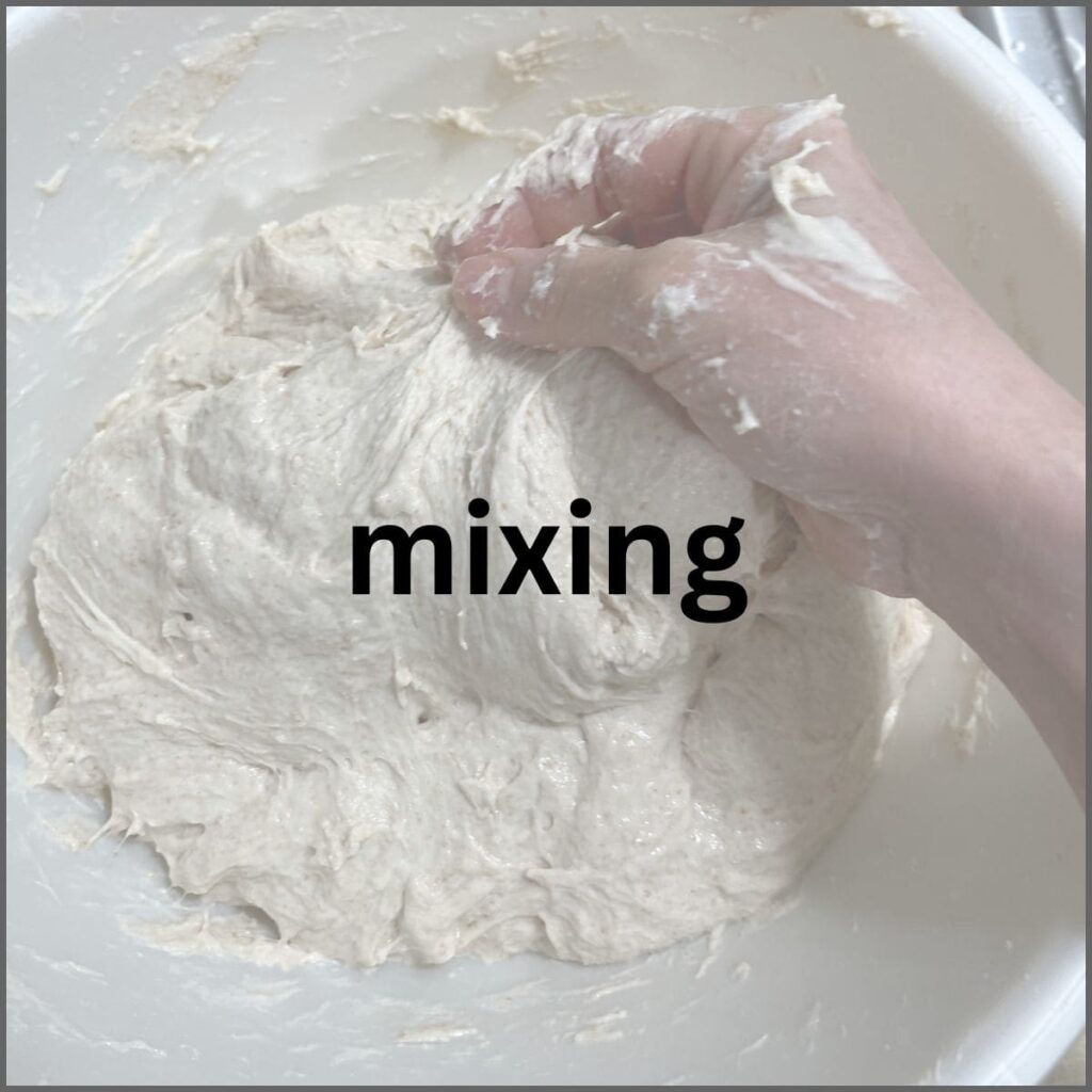 A hand mixing dough.