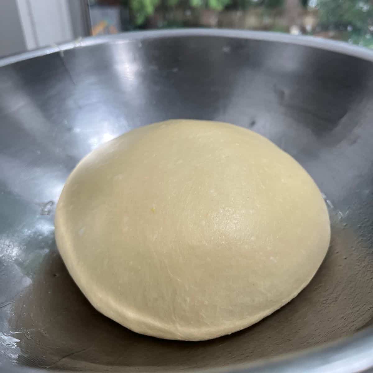smooth ball of dough in a bowl