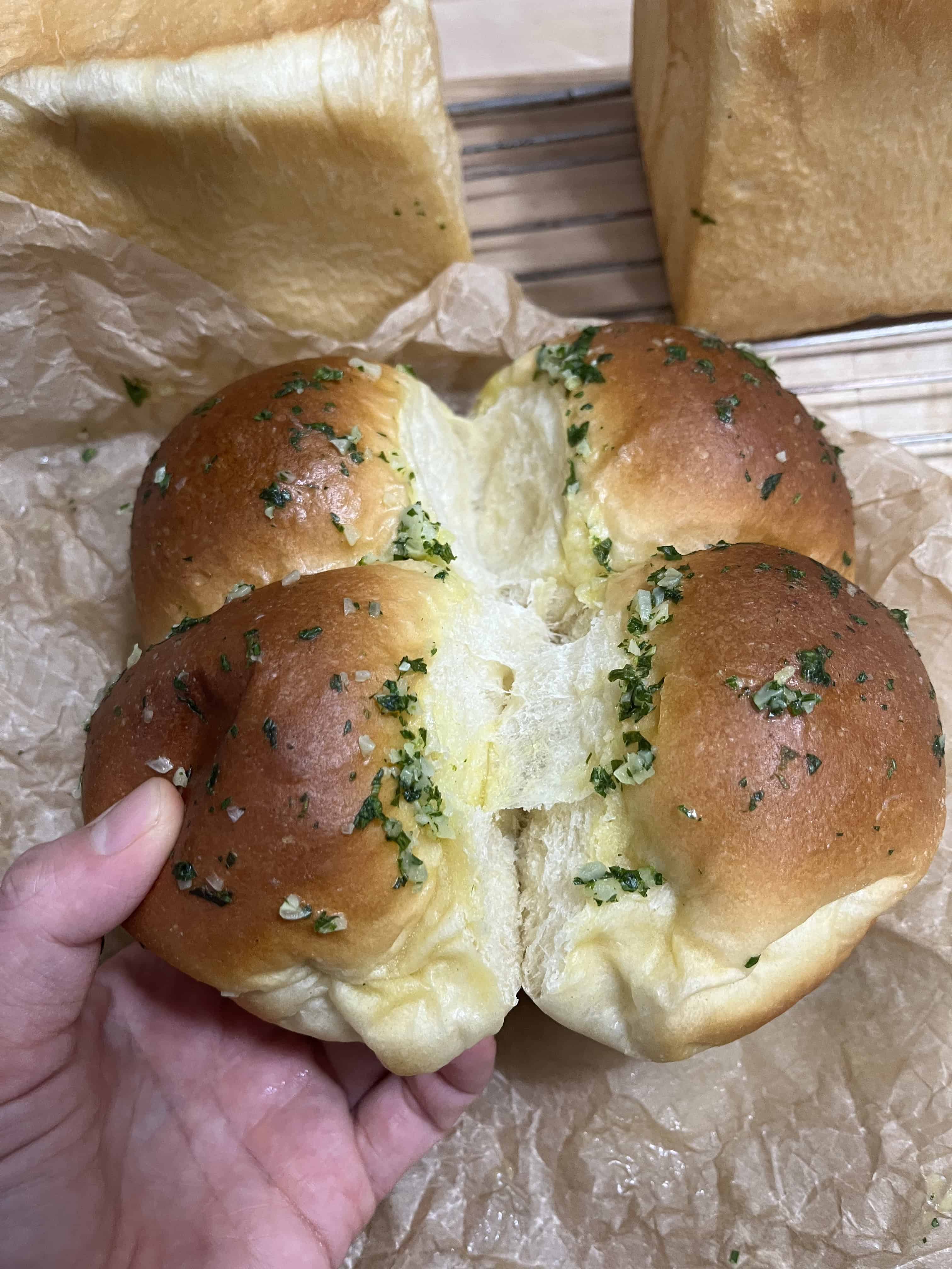 Baked loaves of bread and soft rolls.