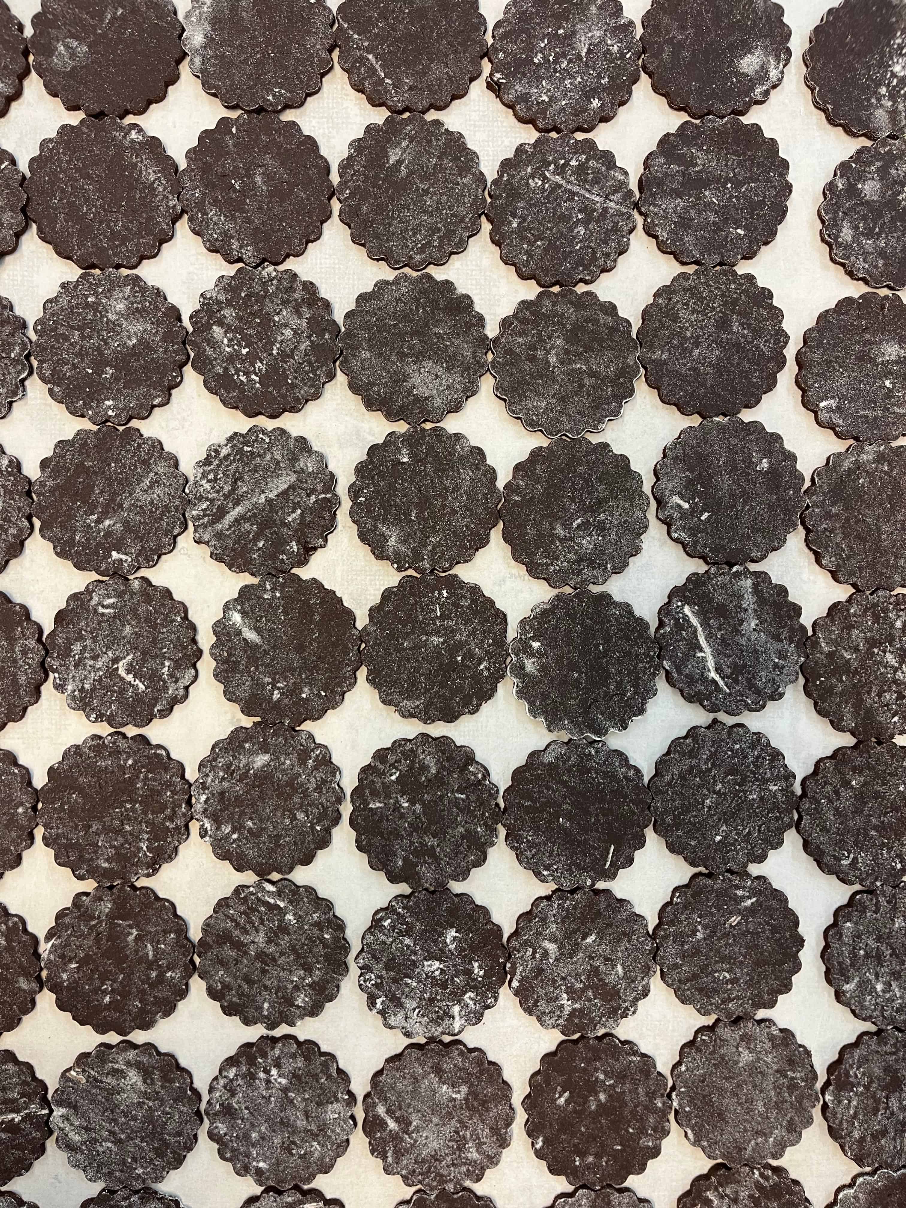 A tray of chocolate cookie cutouts.