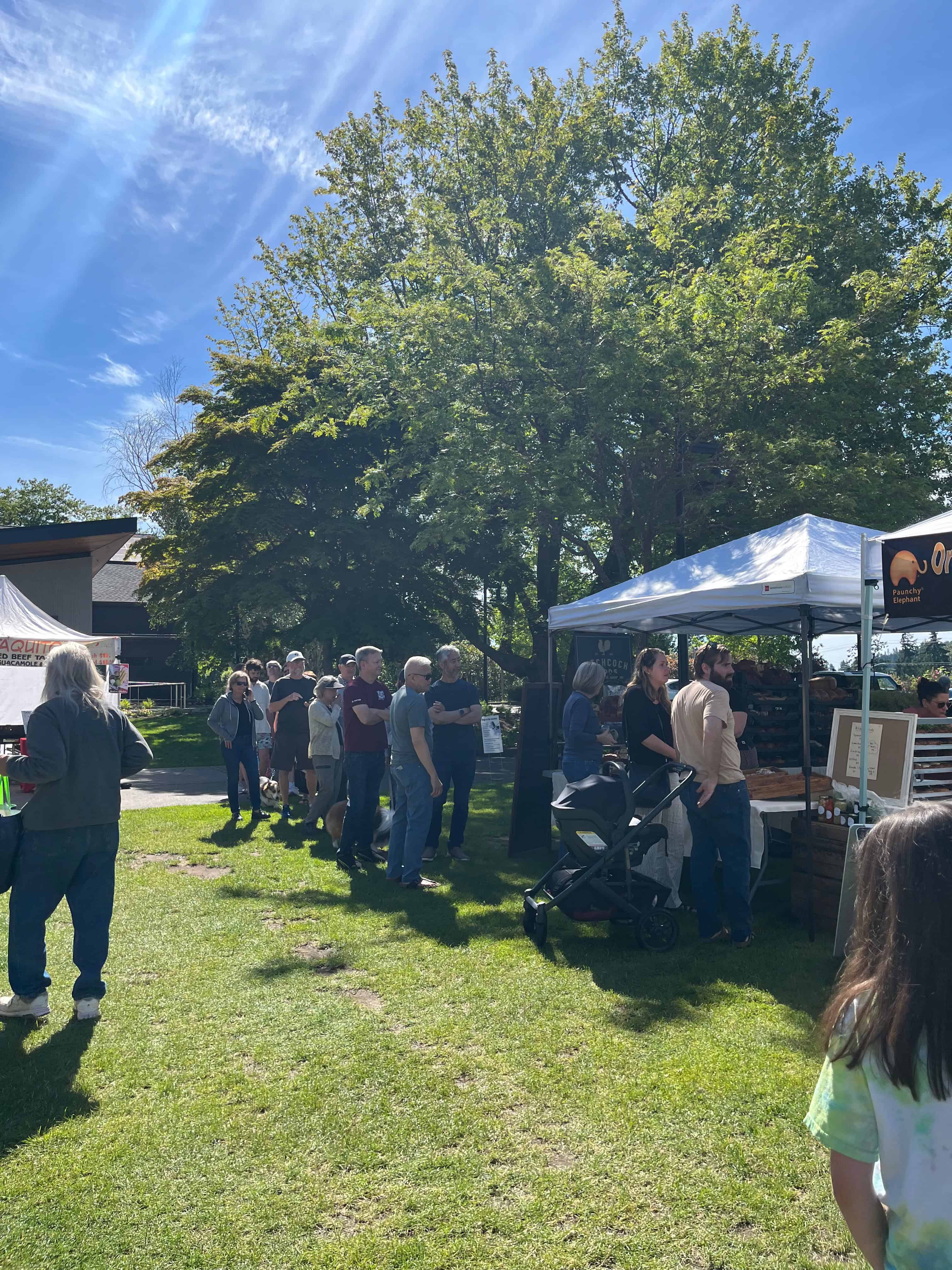 Customers waiting in line to purchase baked goods.