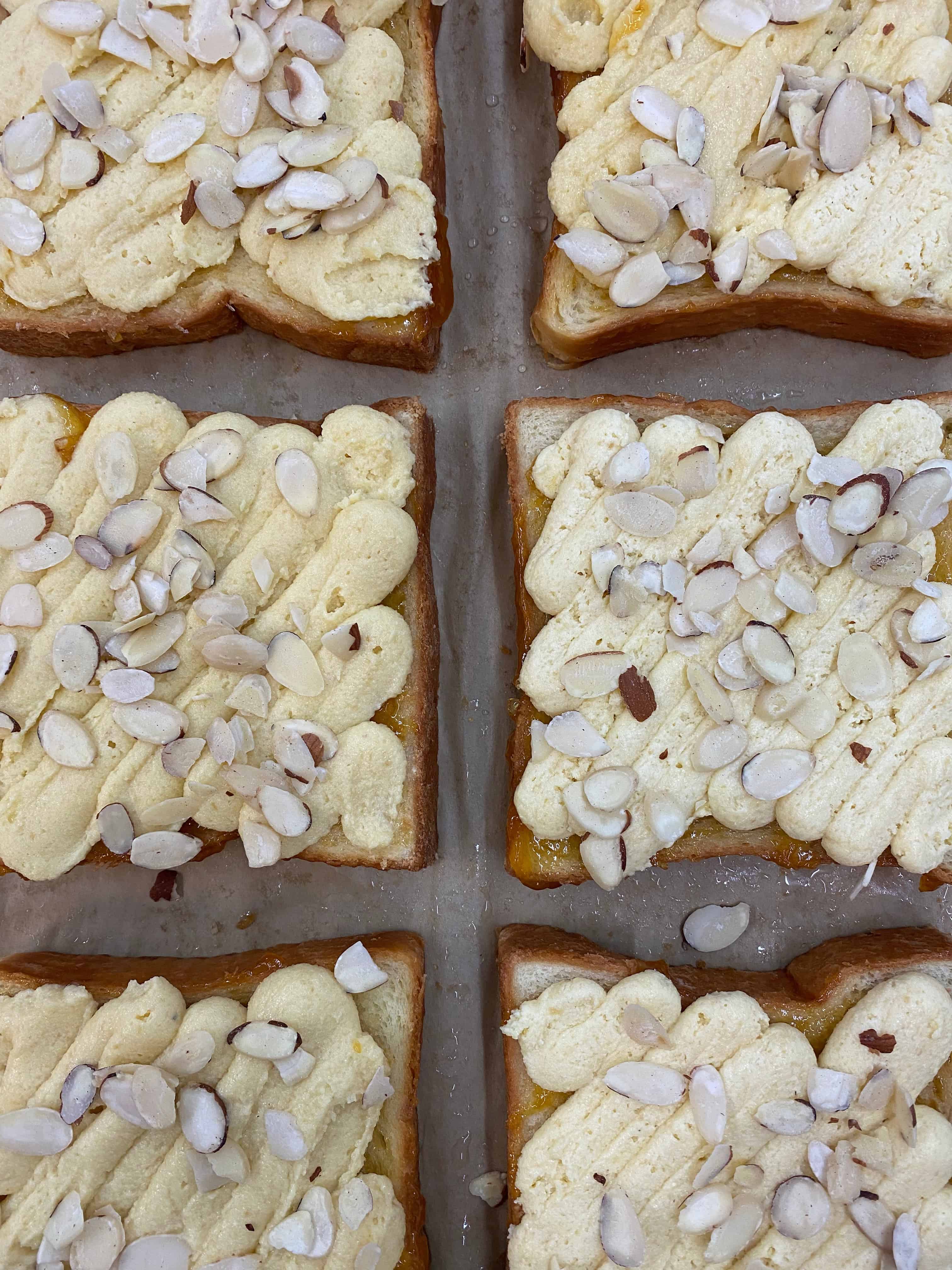Turning leftover brioche into almond bostock before baking.