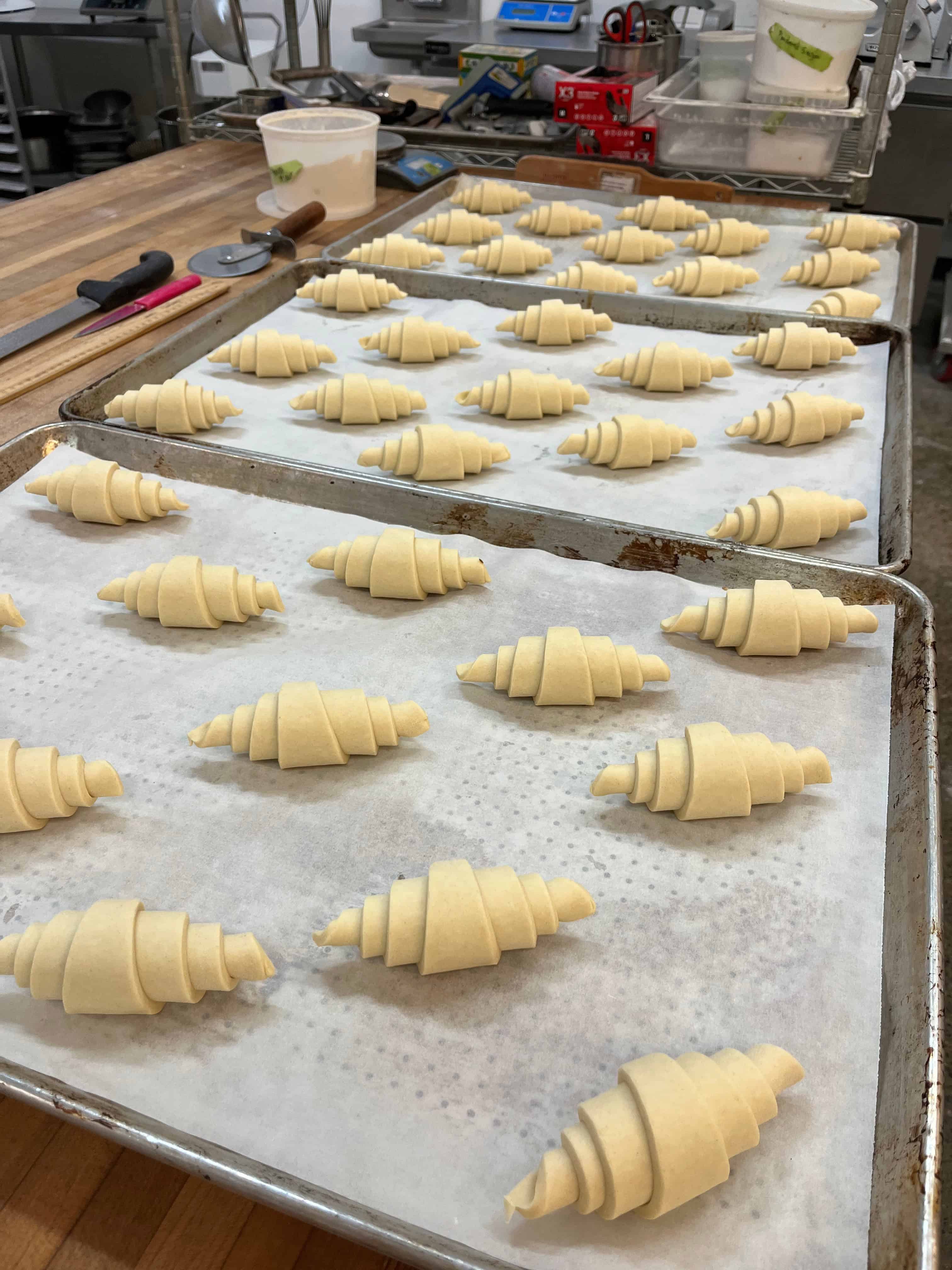 Croissants on tray all look the same - a result of being consistent