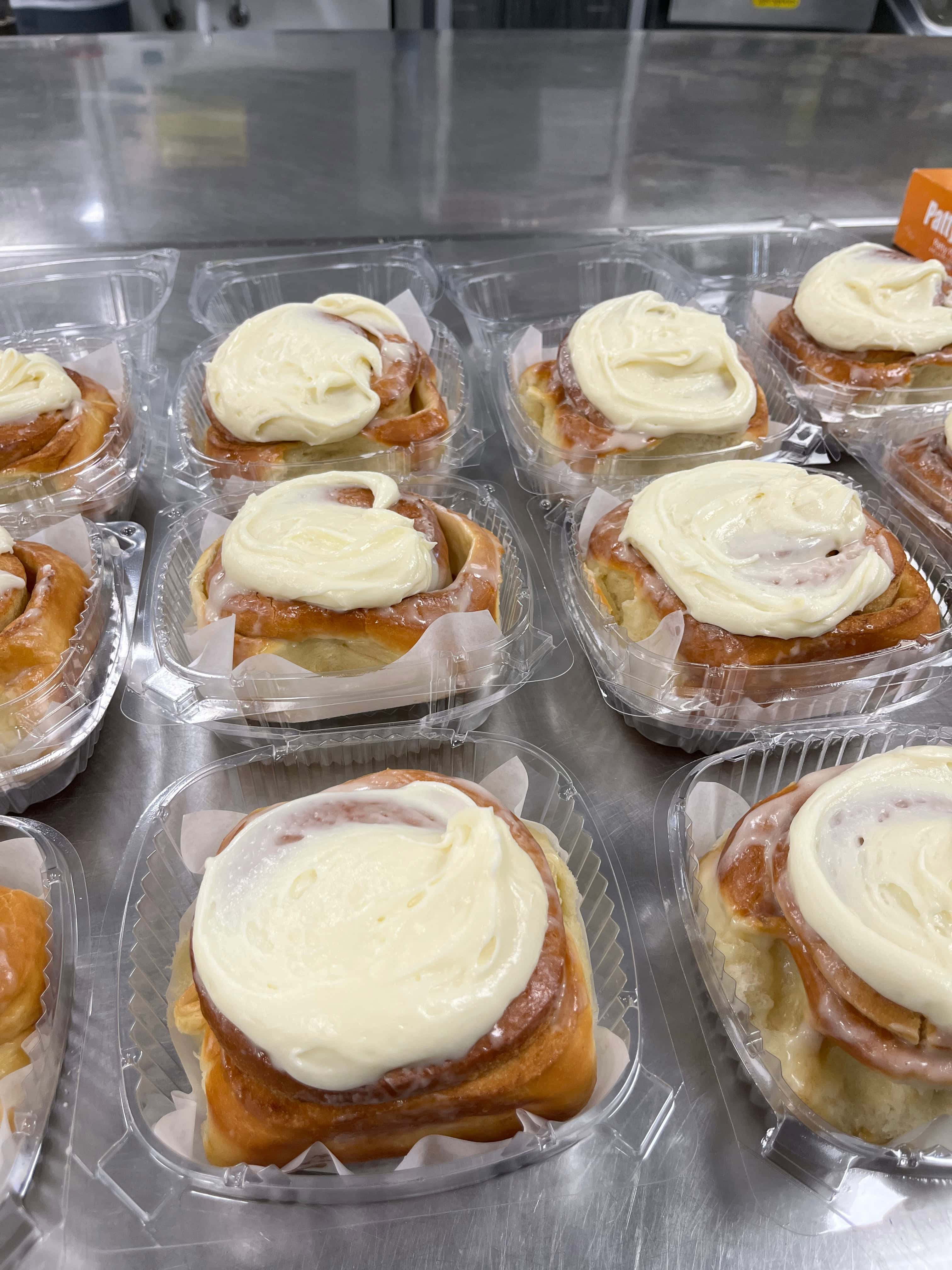 cinnamon roll iced and packaged - ready for selling