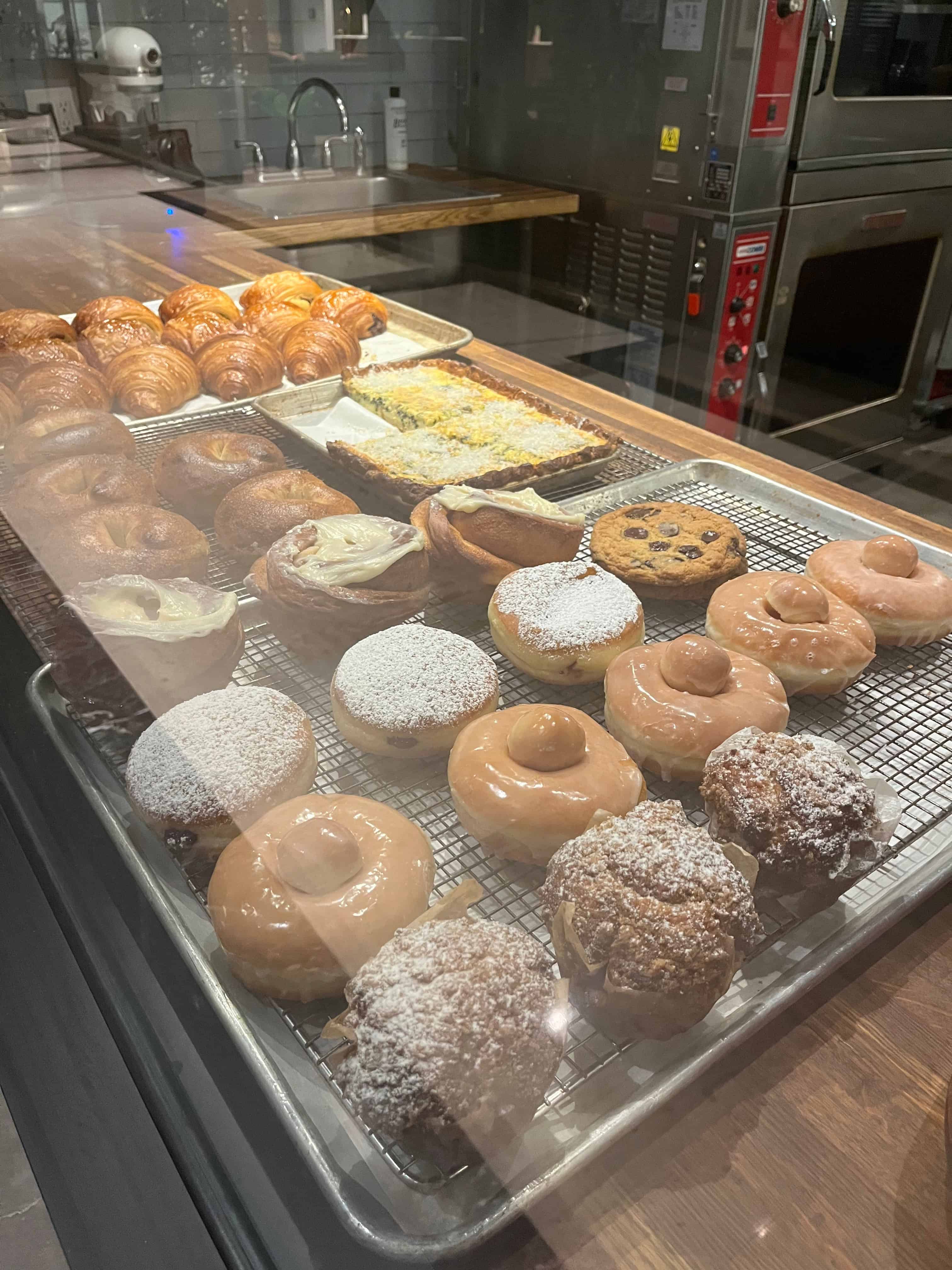 Pastries, quiche and bagels on display