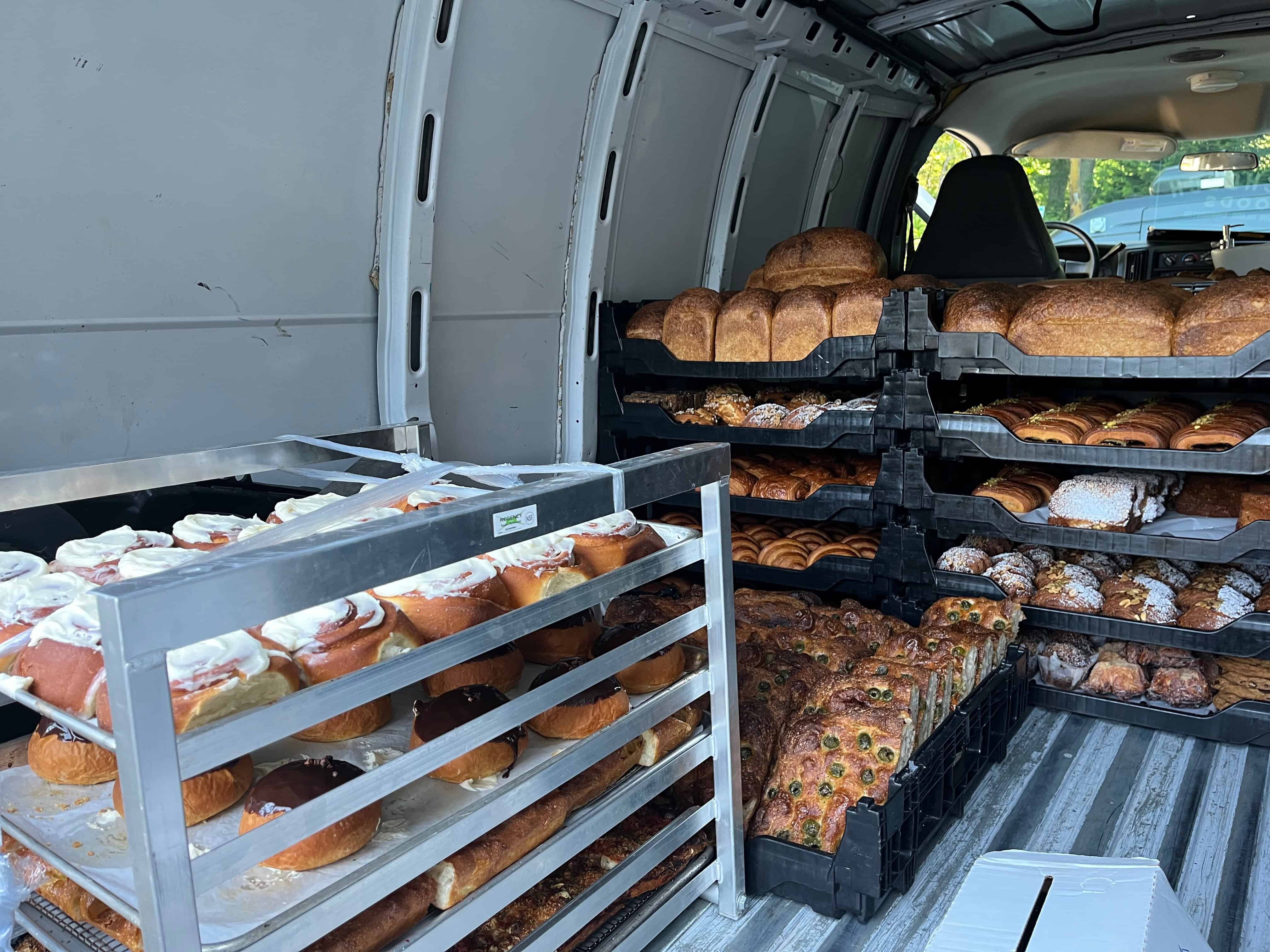 baked goods in a truck ready to be transported to farmer's market