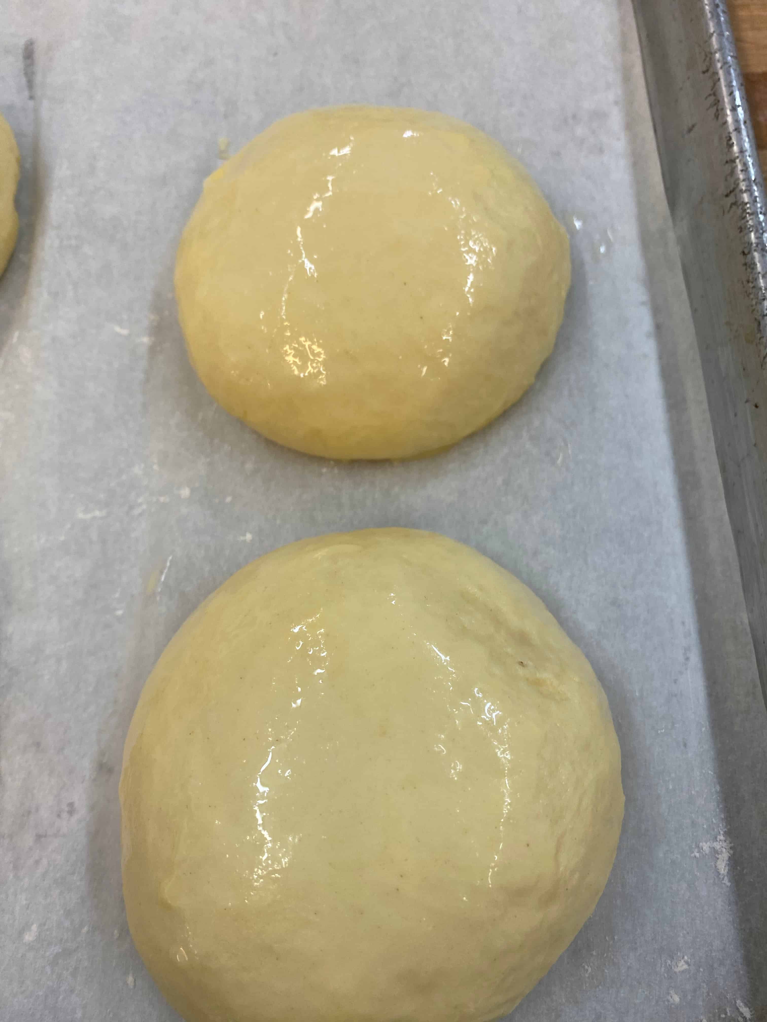 Brioche dough balls proofed and ready for the oven
