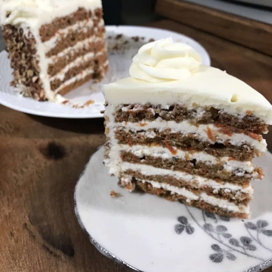 Carrot cake slice with layers of cake and icing