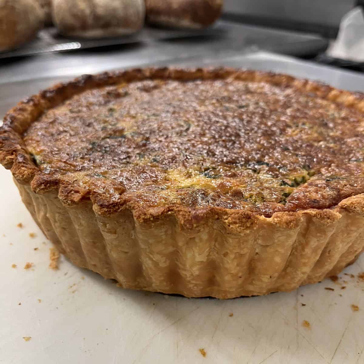 Deep-dish quiche with a golden, crispy crust