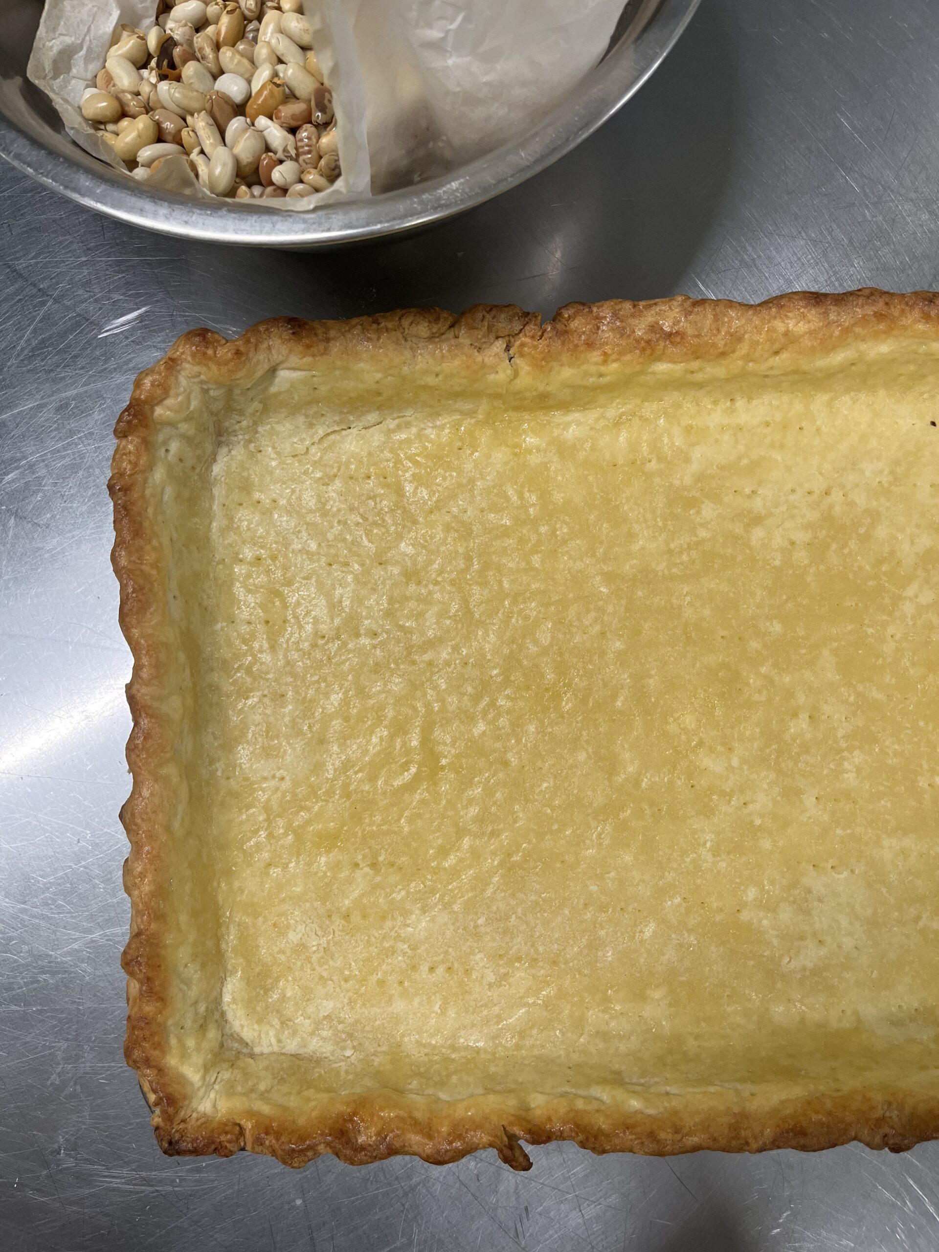 Par baking crust in a half sheet pan