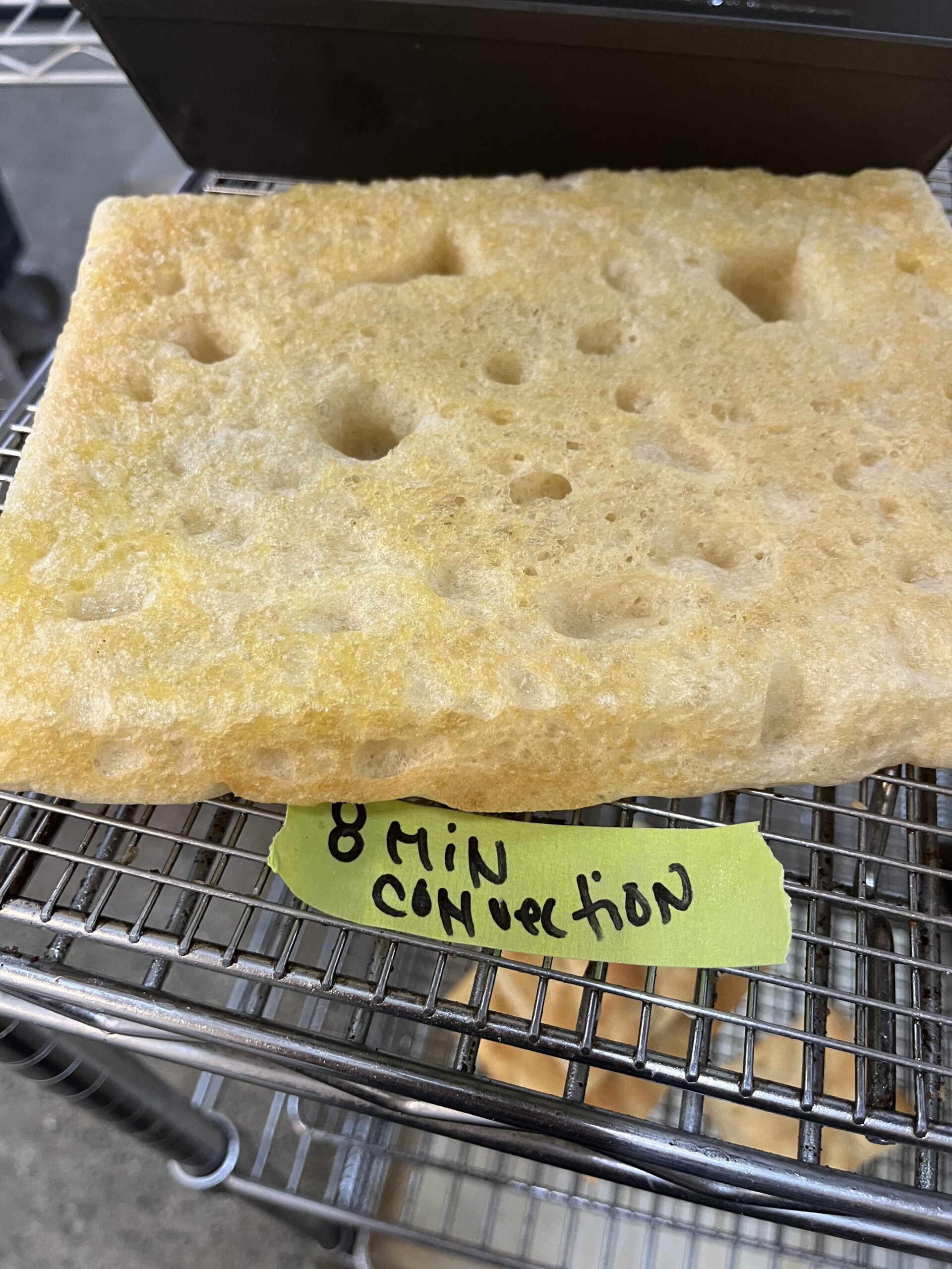 Testing par-baking Detroit-style pizza crust.