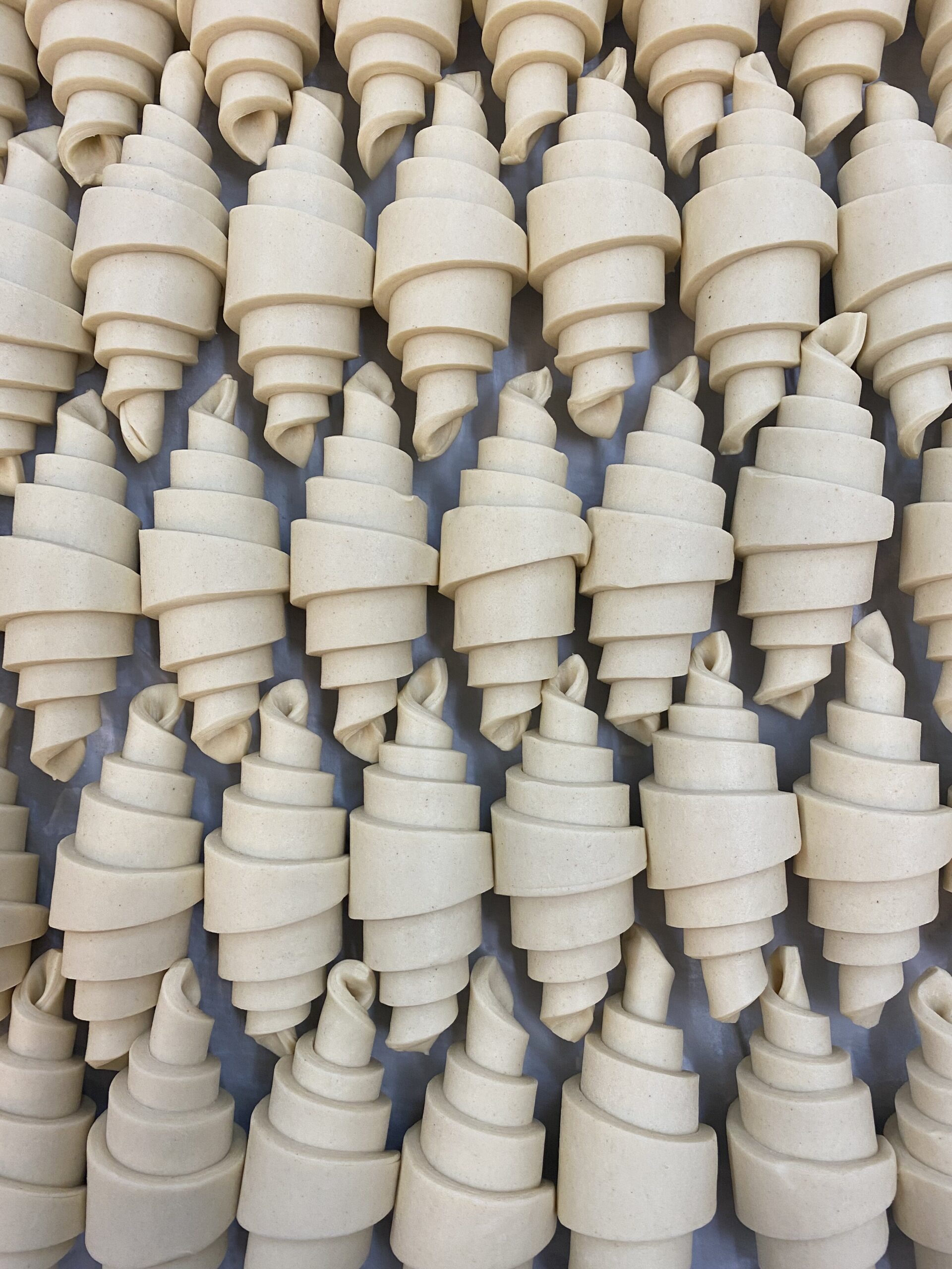 Butter croissants shaped and ready for the freezer.