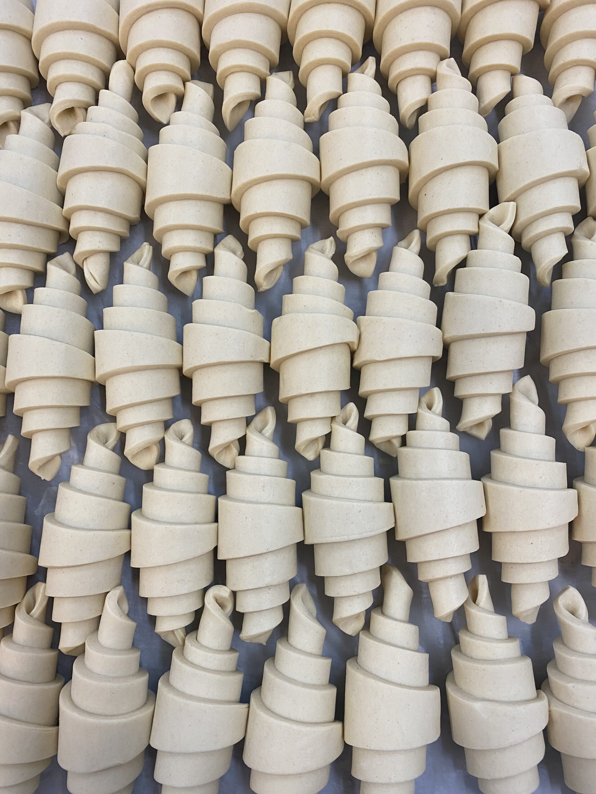 unbaked, shaped butter croissants