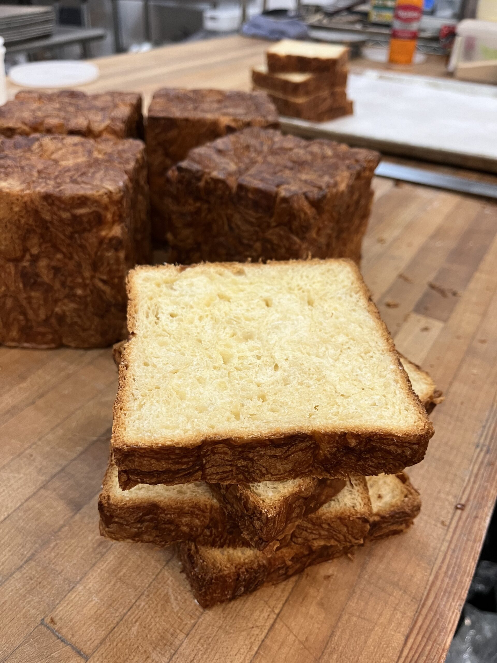 slicing croissant loaves