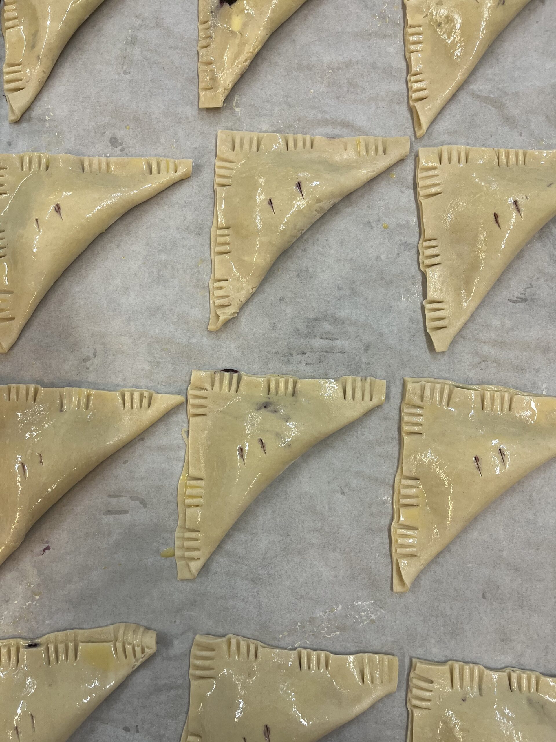 unbaked hand pies on a tray