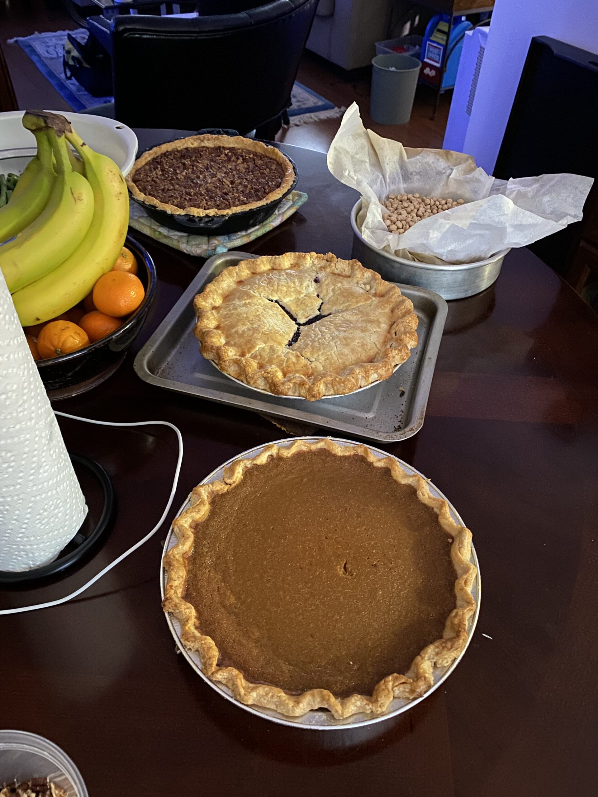 pumpkin, pecan and blueberry pies on the table resting.