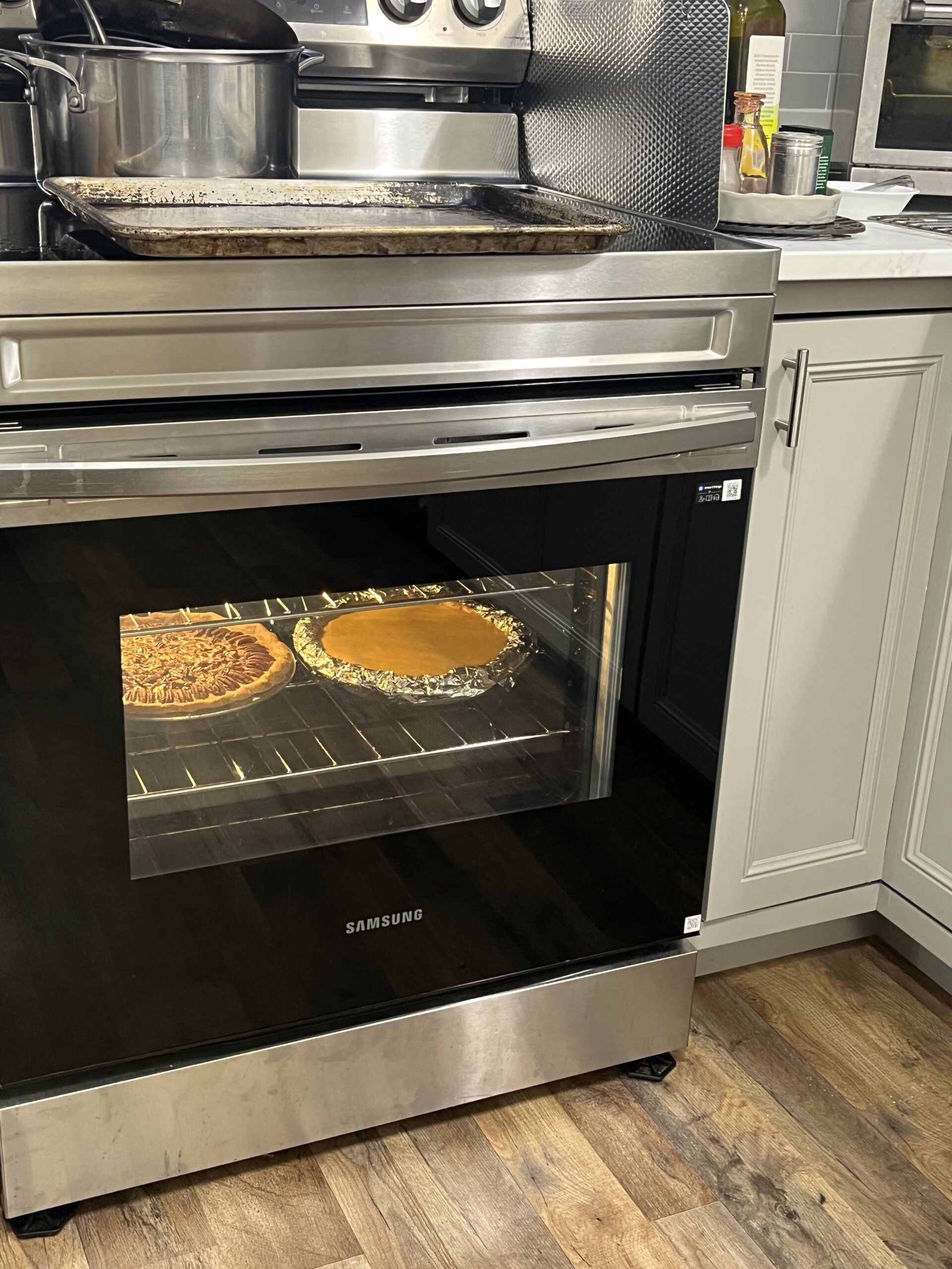 Pecan and pumpkin pies in the oven.